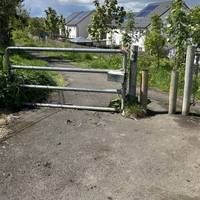 Go past the gate and continue