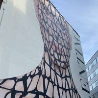 Don’t miss the mural on the side of the building opposite at the junction.