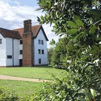 Carefully cross the road and admire the stunning Queen Elizabeth Hunting Lodge, built in 1543 by Henry VIII