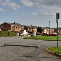 Cross Chestnut Avenue to reach the Circle and head south past the houses.