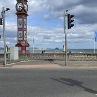 Use the pedestrian crossing to head across The Esplanade to the Queen Victoria Jubilee Clock.