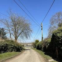 With the church behind you and pub in front of you, head left along the lane. There is no pavement so be aware of moving vehicles.