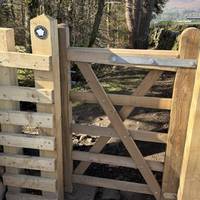 Through the pedestrian gate. Please take note of the signs and help keep the Peak District National Park beautiful for everyone.
