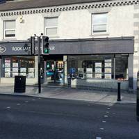 Use the pedestrian crossing on your right to cross Priestpopple road and then turn left on the other side.