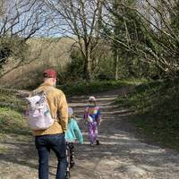 Follow the track to the right and stay right at the fork. You'll be heading uphill on a loose surface.