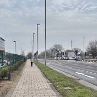 Walk ahead by the dual carriageway.