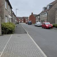 Keep going along the road