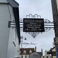 Outside the cafe, turn left down an alleyway towards Butter Cross market place.