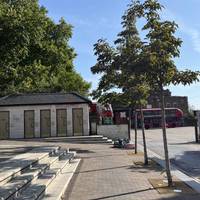 Cross over Mare Street and continue ahead, walk past the steps and towards the ramp and toilets.