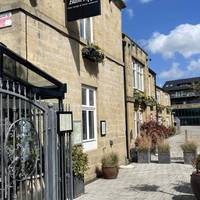 Pass or stop for a quick drink or bite to eat at Buon Apps. Continue along the river path keeping the river to your left.