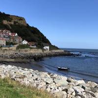 You can walk around to find fossils in the cliff on the far side of the beach but we headed back to explore the village