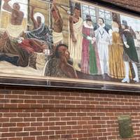 On your left will be the Pocahontas Mural. It depicts the story of how Princess Pocahontas came to be in Gravesend.