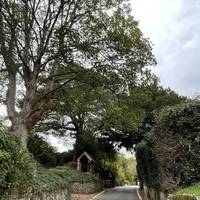 It's a quiet road with no pavement and you need to follow it to the end.