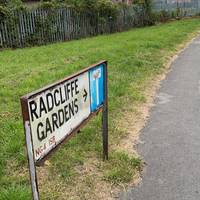 Keep walking along the pavement into Radcliffe Gardens