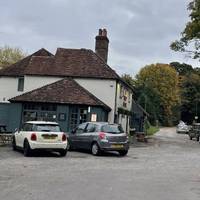 You'll soon reach the main road and the Half Moon inn on the left.