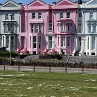 Over to the right you’ll pass some brightly coloured buildings.