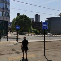 Turn left to cross Lower Mosley St towards Bridgewater Hall via the tactile paving. Cross the tram lines and then two push-button crossings.