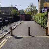 Keep ahead through bollards into a residential street (Coleridge Way). Follow to the end, bend left and then turn right into Auden Drive.