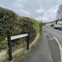 Turn left onto Riverside Road, heading slightly downhill. The Pavement is flat here.