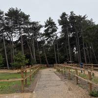 Walk towards the woods. There’s often a coffee/crepe van here for take away food but not here everyday.