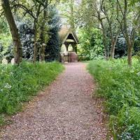 Enter the churchyard, and leave through the lychgate on the other side.