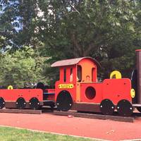 To the left of the park there is a brilliant bright-red train and is perfect for little train enthusiasts.
