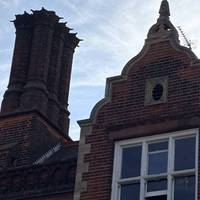Look up and you will see Flemish gables and impressive chimney stacks. It was designed by John Shewell Corder in 1896.