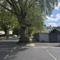 Carefully cross over this side road and get ready to turn immediately right down an alleyway.