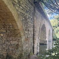 Pass under the bridge. This toll bridge is one of just two privately owned on the Thames. The other is the Whitchurch Bridge by Pangbourne.