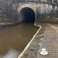 Walk to mouth of Standedge Tunnel. This is the highest, deepest and longest canal tunnel in Great Britain.