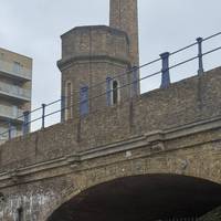 Walk around the basin and you spot this tower above the DLR viaduct. This was part of a hydraulic power system for cranes in the basin.