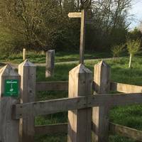 Go through the kissing gate by the car park. You will see a board near the gate showing suggested walks
