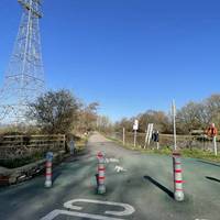 Upon reaching the canal, turn left to cross the road and head through the striped bollards onto the shared tarmac towpath.