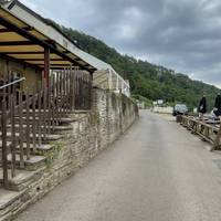 From the Symonds Yat East side, facing the Saracen's Head Inn, turn right along the road. There is no path so look and listen for vehicles.