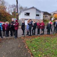 Walk past the Community Orchard on your left.