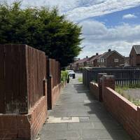 Follow the path through the estate.