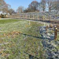 Stay on the path guided by waymarks. Turn left on reaching a grassy earth track.