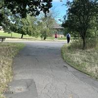 At the end of the path, fork right and then bear right passing the band stand.