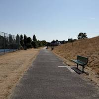 Continue along the path. If you have time, take a seat to watch some of the tennis players enjoying a match.