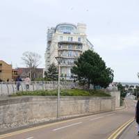 At the top of the hill there are several ways to get onto the promenade. Follow the road all the way down.