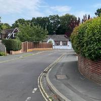 Leave the car park and walk towards the Parish Hall.