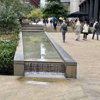 Walk up to the right of the water features along Pancras Square.