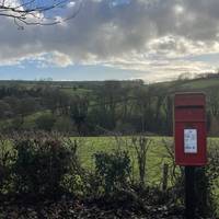 To your left by the postbox there are lovely views between the trees up Crow’s Hill.