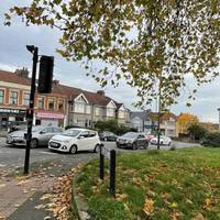 Head left on the opposite side to walk around the grass and into Muller Road.