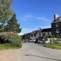 With your back to the car park, head left up Parrog Road.