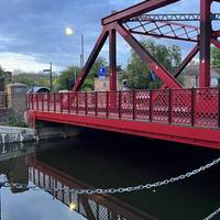 Cross the vibrant red bridge in Shadwell Basin and keep an eye out for graceful swans, bringing an air of elegance to your walk.