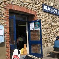 At the Beach Cafe there’s loos just behind. The beach has some sand at low-tide and a lot of people visit for a good fossil hunting session.