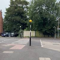 Cross over the zebra crossing and turn left along Conway Road.