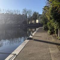 Continue onwards and around the corner. You’ll pass the puppet theatre and the water bus waiting area.