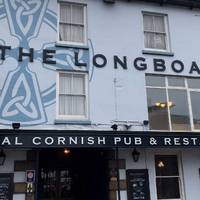 The Longboat Inn opposite Penzance station offers a left luggage service, £3 per item. Handy if you want to wander round town luggage free. 